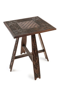 Isaac Albert Newton chip carved games top table decorated with carved wattle and wild flowers,