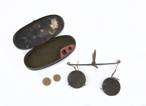 Pocket gold miner's scales in ebonised tinware case, 19th century