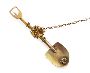 Ballarat goldfields brooch, yellow gold shovel with gold nugget specimens entwined in rope,  most likely by H.F. HUTTON, 19th century 