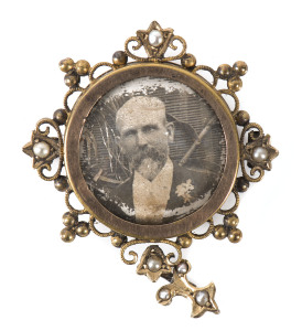 An antique photo brooch, rose gold and seed pearl mount, late 19th century
