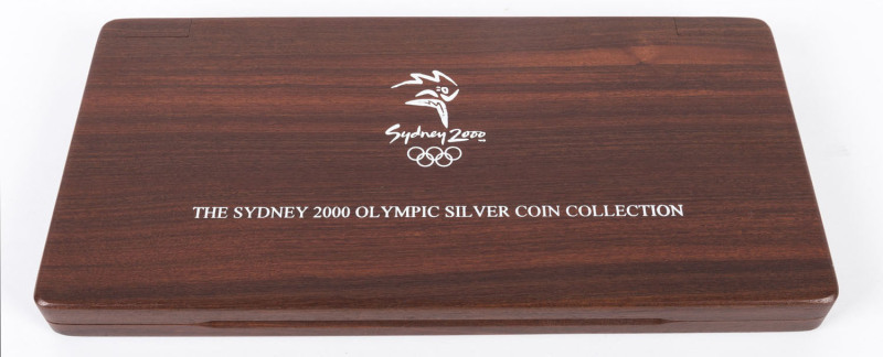 Coins - Australia: Silver: 2000 Olympics silver sixteen $5 coin set of Proofs - in jarrah case, each with individual Certificate of Authenticity. 