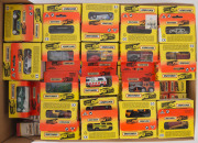 MATCHBOX: A collection of approximately 105 Matchbox cars from 1993 in orange and yellow display boxes; all mint and boxed. Together with a group of approx. 50 empty boxes.