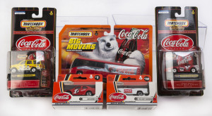 MATCHBOX: A group of Matchbox Coca-Cola cars including Alfa Romeo 155, 1955 Chevy Convertible; all mint in original opened packaging (22 items).