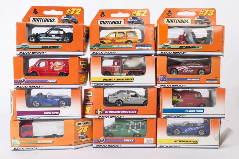 MATCHBOX: A large group of Matchbox cars in orange boxes including Dodge Viper, Ford Expedition, Ford Falcon; all mint in opened original packaging.