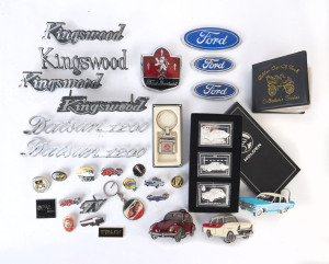 CAR BADGES: An assortment of various car badges and automobilia including Ford, Datsun 1200, Kingswood; and others