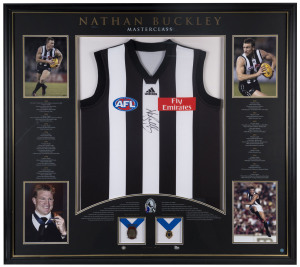NATHAN BUCKLEY (Collingwood), display 'Nathan Buckley Masterclass' comprising signed Collingwood jumper, window mounted with 4 photographs and replica Norm Smith & Brownlow Medals, limited edition 133/200, framed & glazed, overall 188 x 117cm.