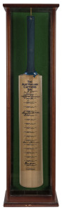 THE AUSTRALIAN CAPTAINS BAT: A full-sized bat displaying the original signatures of 19 different Australian Cricket Team captains from Bradman to Taylor. The bat is displayed in a custom-built display box. Height: 96cm. Some signatures are faded; fully le
