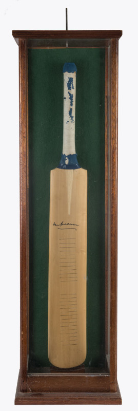 DON BRADMAN signature on a full-sized bat, circa 1985. (Rubber grip deteriorated). In a presentation case (which requires some attention).