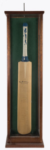 DON BRADMAN signature on a full-sized bat, circa 1985. (Rubber grip deteriorated). In a presentation case (which requires some attention).