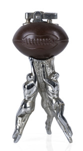 An Australian rules football novelty table cigar lighter, chromed and anodized metal, mid 20th century,