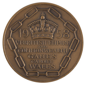 6th BRITISH EMPIRE & COMMONWEALTH GAMES, CARDIFF, WALES, 1958: Bronze Winner's Medal, 44mm, awarded to John Simpson of Australia for Fencing Epee Team and so engraved on reverse. Together with the original box for Simpson's participation medal (which is n