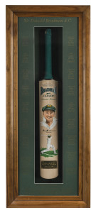 DON BRADMAN SIGNED & HAND-PAINTED BATA full-sized Bradman Classic Limited Edition bat by Slazenger, enhanced with two original paintings of Don Bradman by Colin Bodie. The bat is displayed in a custom built glass-fronted case, surrounded by details of The