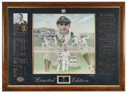 "A TRIBUTE TO THE DON 1908-2001", very large colour print by Brian Clinton, depicting Bradman playing his classic cover drive on the way to his record-breaking innings of 334 at Headingley in 1930. The print is mounted with career details and is signed to