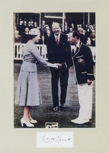 LINDSAY HASSETT, autograph below a reproduction colour photograph of him shaking hands with the Queen; framed & glazed, overall 49 x 41cm.