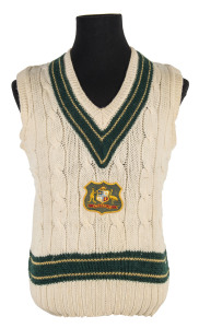 DENNIS LILLEE'S Australian test Jumper, sleeveless, with embroidered Australian coat-of-arms badge on front, with initials 'DKL maker's label'. Purchased at Dennis Lillee's Testimonial dinner in Brisbane in 1981; accompanied by the Menu/Programme thanking
