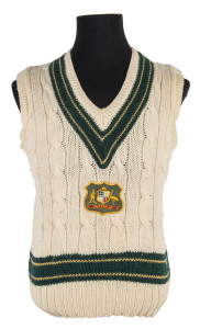 DENNIS LILLEE'S Australian test Jumper, sleeveless, with embroidered Australian coat-of-arms badge on front, with initials 'DKL maker's label'. Purchased at Dennis Lillee's Testimonial dinner in Brisbane in 1981; accompanied by the Menu/Programme thanking Alan Piper for his purchase (signed by Lillee); further autographed by Garfield Sobers & Greg Chappell (who were the guest speakers) and Rod Marsh, Ray Lindwall & Kim Hughes who were amongst the honoured guests.