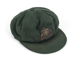 STAN McCABE'S 1936-37 AUSTRALIAN BAGGY GREEN TEST TEAM CAPgreen wool, coat of arms worked with gold and silver wire and coloured silk, Farmer's Sydney label inside crown inscribed in ink S.J.McCabe.  A HIGHLY IMPORTANT AND ROMANTIC PRIMARY OBJECT ASSOCIAT