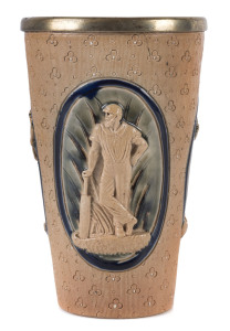 A Royal Doulton Lambeth Ware cricket beaker with silver rim. Three scenes of cricketers in high relief on a light green glazed background. Impressed mark and registration number to base. Two hairline cracks, mainly visible internally. A handsome piece. 13.5cm high.