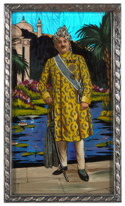 AN ORIGINAL HAND-PAINTED PICTURE OF RANJITSINHJI COMPOSED OF REAL BUTTERFLY WINGS, circa 1912 Ranji standing in a colourful landscape, wearing a matching turban and diamond-buttoned tunic sherwani, plain trousers and silver-buckled shoes. He wears his British awards of GCSI and GBE, with his sash of office. He holds his state sword wrapped in a silk shawl and wears a diamond necklace. Commissioned by Ranji and with a "Made in England" label on the reverse of the white metal frame on stand. 18 x