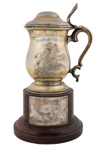 FLEMINGTON 1975: The "Carlton & United Breweries Limited Trophy - Marlborough Hurdle Race" presentation silver-plate cup mounted on a base with the panel engraved "Won by TIPPING TIME Owned by K.J., S.D., & Mrs. A. SOUTHWICK". Overall 27.5cm high.