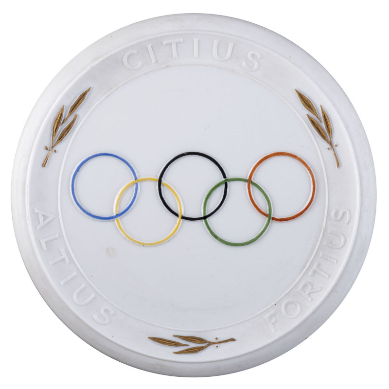 Ceramic Plaque of honour for the German Olympic Team "Gesamtdeutsche Olympiamannschaft Melbourne 1956", reverse with handpainted Olympic rings. Plaque by Meissen; size 9.5cm. Only 100 examples of this plaque were produced. Superb condition.