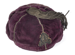 HUGH MONTGOMERIE HAMILTON'S MARLBOROUGH COLLEGE RUGBY CAP, circa 1870-72burgundy velvet with mitre emblem embossed in metal thread on the front. Good condition, considering its' age. A very important Australian link with the earliest history of internatio