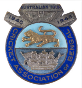 The AUSTRALIAN SERVICES XI TOUR OF INDIA 1945-46An attractive lapel badge titled "AUSTRALIAN TOUR 1945 - 1946" produced by the CRICKET ASSOCIATION OF BENGAL to commemorate this first international tour following the end of World War Two. In the original C.A.B. box by S.C.Roy, Calcutta.The Services team was captained by Lindsay Hassett and included other notable players in Keith Miller and Cec Pepper. The team arrived in India during October and played 8 matches in India. They played a Pr