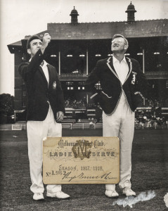 Melbourne Cricket Club Ladies Reserve ticket for the 1917 - 1918 season; signed by the Secretary, Hugh Trumble. Displayed in a glazed frame with a photograph of "the toss" taking place on the field of play. [Membership cards from the War years - male or f