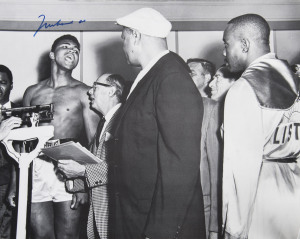 MUHAMMAD ALI, signed b/w photograph of Ali at weigh-in with Sonny Liston, size 41 x 51cm.