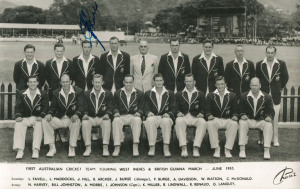 AUSTRALIA in the WEST INDIES: black & white RP postcard of the First Australian Team to tour the West Indies & British Guiana, March - June 1956, signed in ink by all 16 players in the squad, which included Ian Johnson (Capt.), Miller, Lindwall, Benaud, M