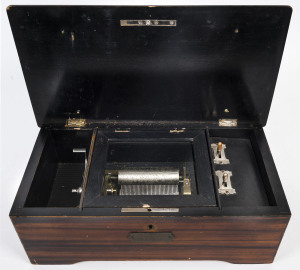 An antique Swiss music box with wood grained case, 19th century