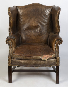 An antique English wingback armchair, 19th century