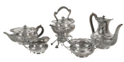 A 5 piece English sterling silver tea set comprising a spirit kettle, teapot, coffee pot, sugar basin and milk jug by Elkington & Co. London, 1966