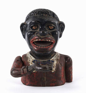 Antique American cast iron money box, early 20th century, 17cm high.