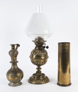 An antique brass kerosene lamp, a WW1 artillery shell and a Middle Eastern hookah pipe (incomplete),