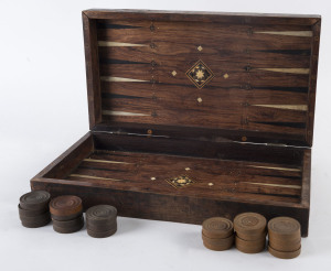 A Middle Eastern inlaid games board and turned wooden games pieces, 19th century