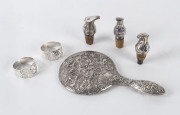 A boxed pair of sterling silver napkin rings, 3 Continental silver wine bottle pourers, and a silver vanity mirror, 19th and 20th century,