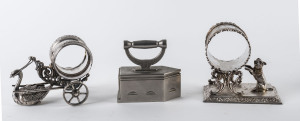 Two novelty silver plated napkin rings and a collar iron, 19th century,