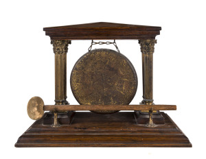 A dinner gong, English oak with ormolu Corinthian columns, late 19th century,