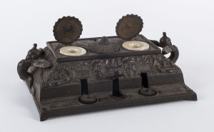 An American cast iron inkwell with three ink pots, late 19th century,