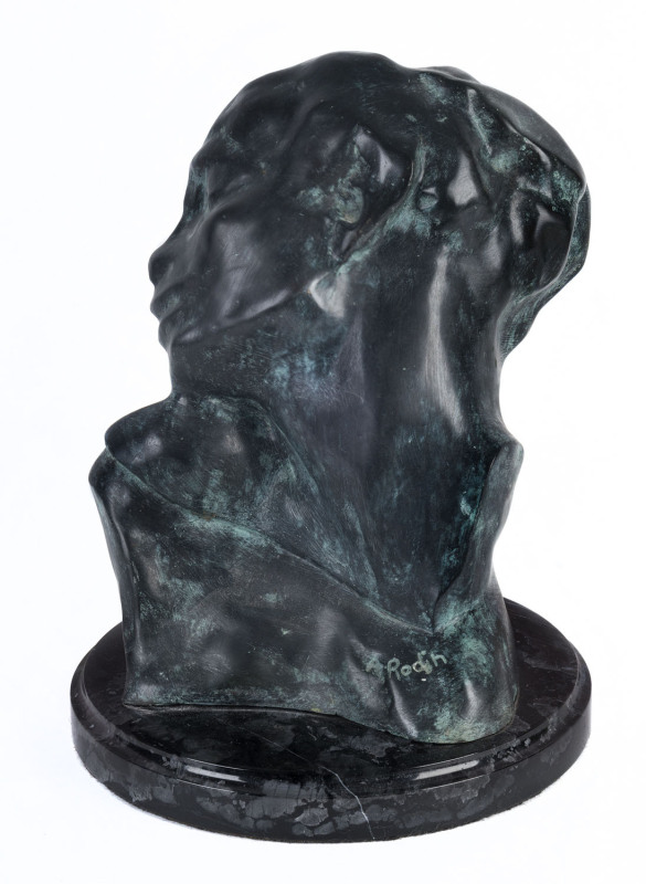 After AUGUSTE RODIN, (1840-1917), "Head of Lust" (Tête de la Luxure), bronze and marble, signed in bronze "A. Rodin",