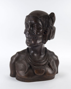 A carved wooden bust of a tribal figure, Indonesian, 20th century,