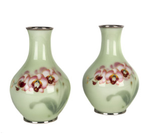 A pair of Japanese cloisonne vases with orchid decoration on green ground, Meiji period,