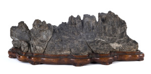 Seiseki scholar's stone on a carved wooden base, Japanese, Meiji period, 19th century,