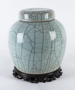 A Chinese celadon crackle glazed ginger jar on wooden stand, 19th/20th century
