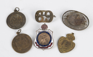 A fine WW1 badge showing an A.I.F. rising sun crest on an oval-shaped filigree field (marked "STERLING/MADE IN PALESTINE" on reverse); also a Returned Sailors & Soldiers Imperial League Australia badge (by Stokes of Melbourne); a 1902 Coronation badge (Ha