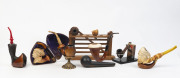 Collection of pipes and tobacciana&nbsp;including fine carved meerschaum examples, rack and stands, 19th and 20th century,