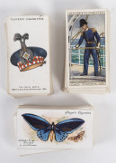 JOHN PLAYER & SONS: 1930 "History of Naval Dress" almost complete set (46/50), 1931 "Military Head-Dress" part set (35/50) & 1932 "Butterflies" almost complete set (48/50). Mainly VF. Cat.&pound;145.
