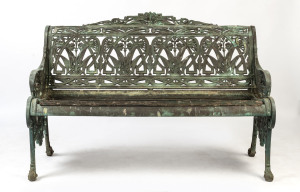 A garden bench, solid cast bronze and timber, English, 19th/20th century, 129cm across the arms