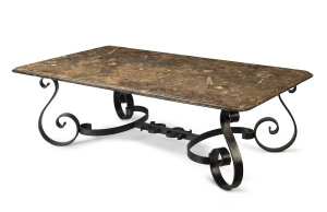 A coffee table, wrought iron with stone slab top with fossilized specimen inclusions, French, 20th century,